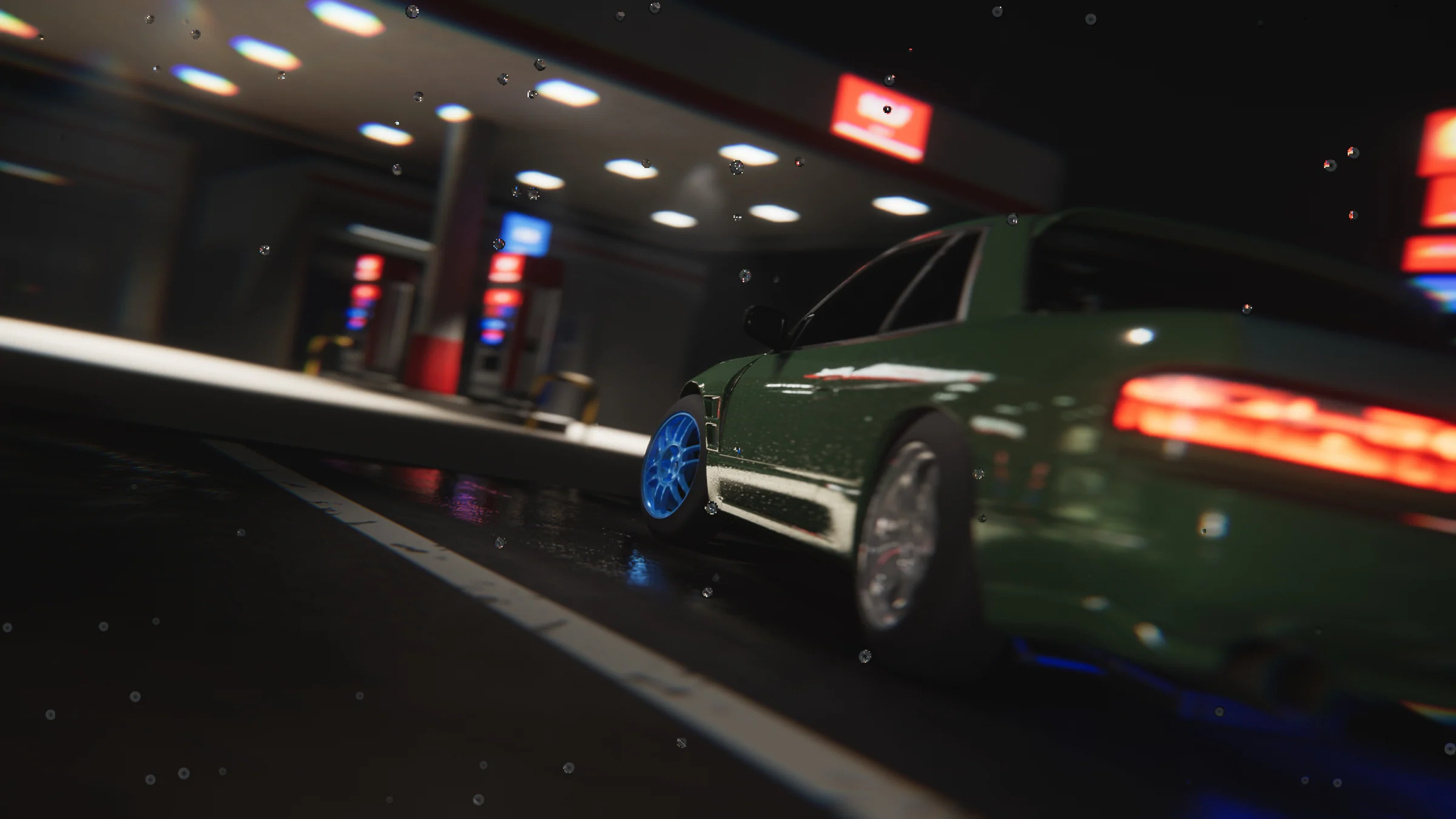 Low rear-quarter view of the green coupe with a blue front wheel beneath the fuel station lights