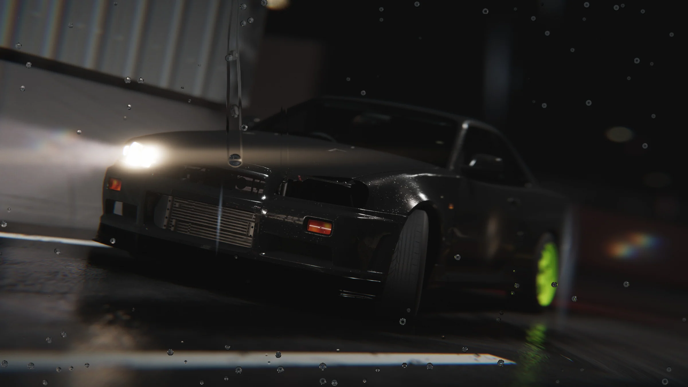 Dark coupe with lime-green wheels photographed from the front at a fuel station on a rainy night