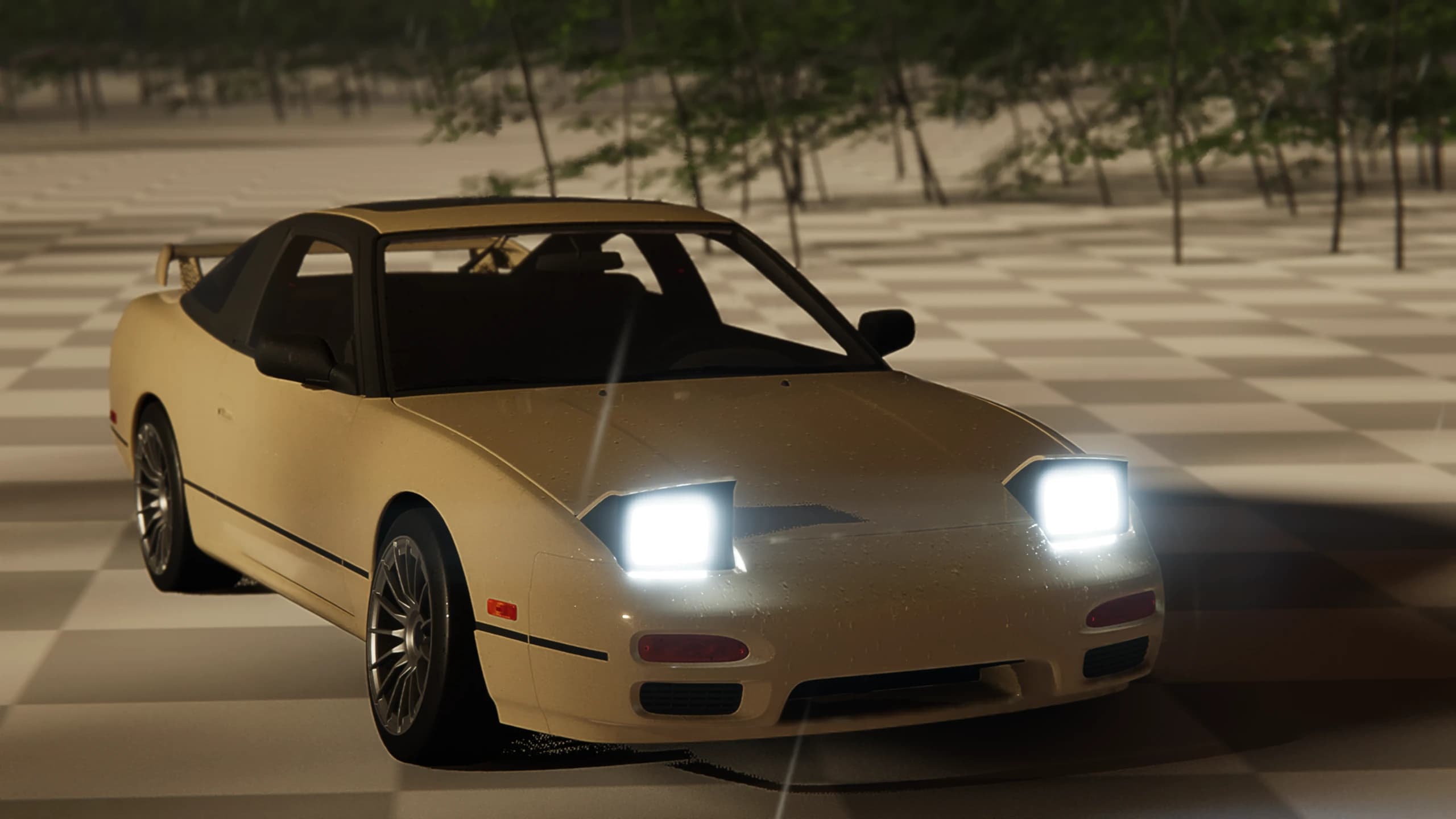 Cream coupe facing the camera with raised headlights