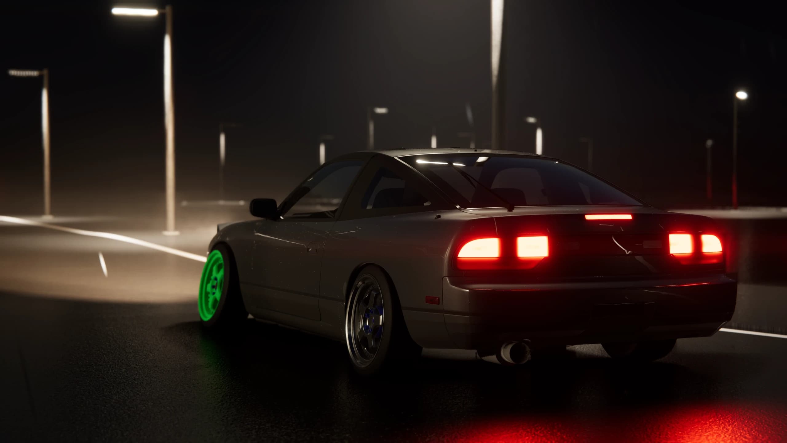 Coupe driving along a wet illuminated road at night