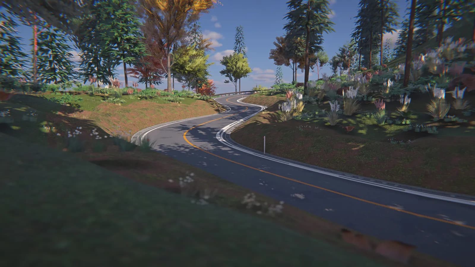 Daylight view of a grey road with a curving yellow line, flowers and trees on the slopes beside it